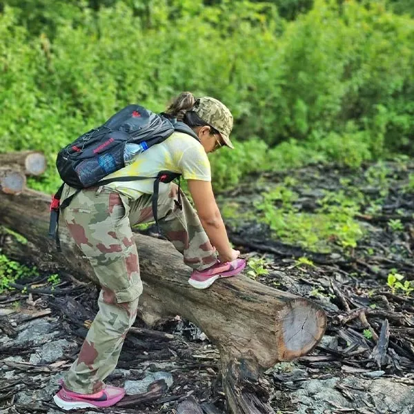 A lady trekking in dandeli jungle